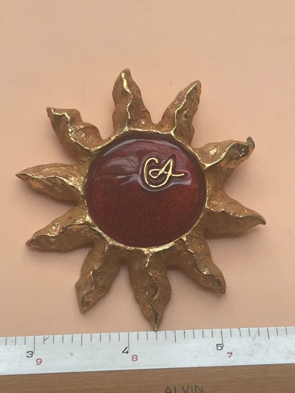 Christian Lacroix Gold-Tone Sun Brooch W/ Red Resin Center & Golden Logo